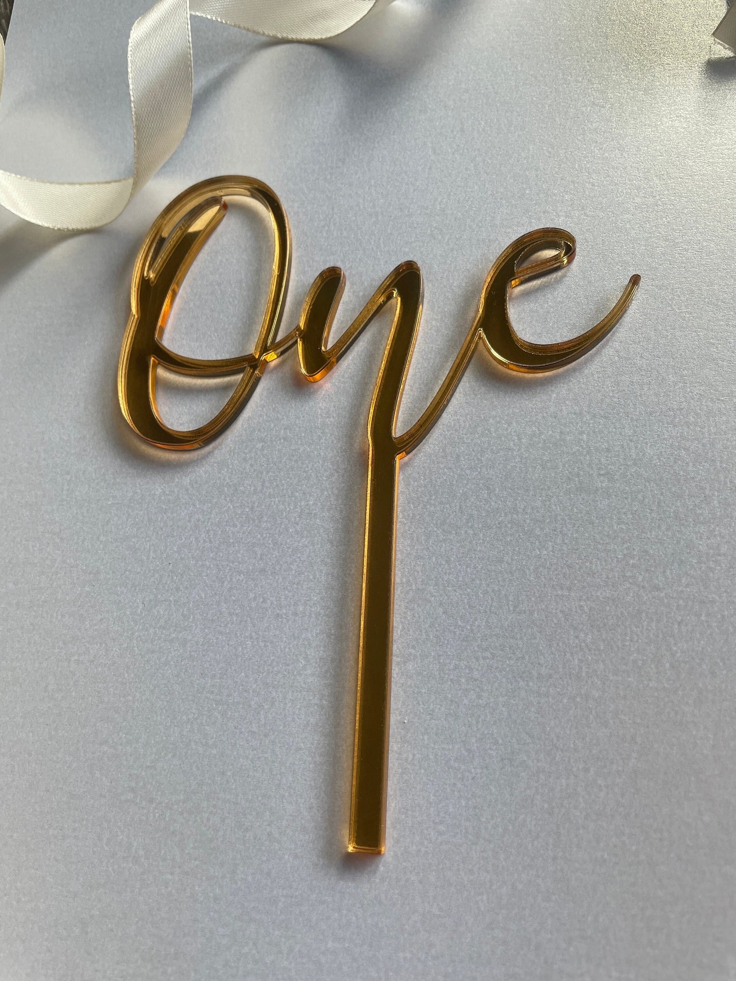 One cake topper. Mirrored acrylic topper. One  cake charm