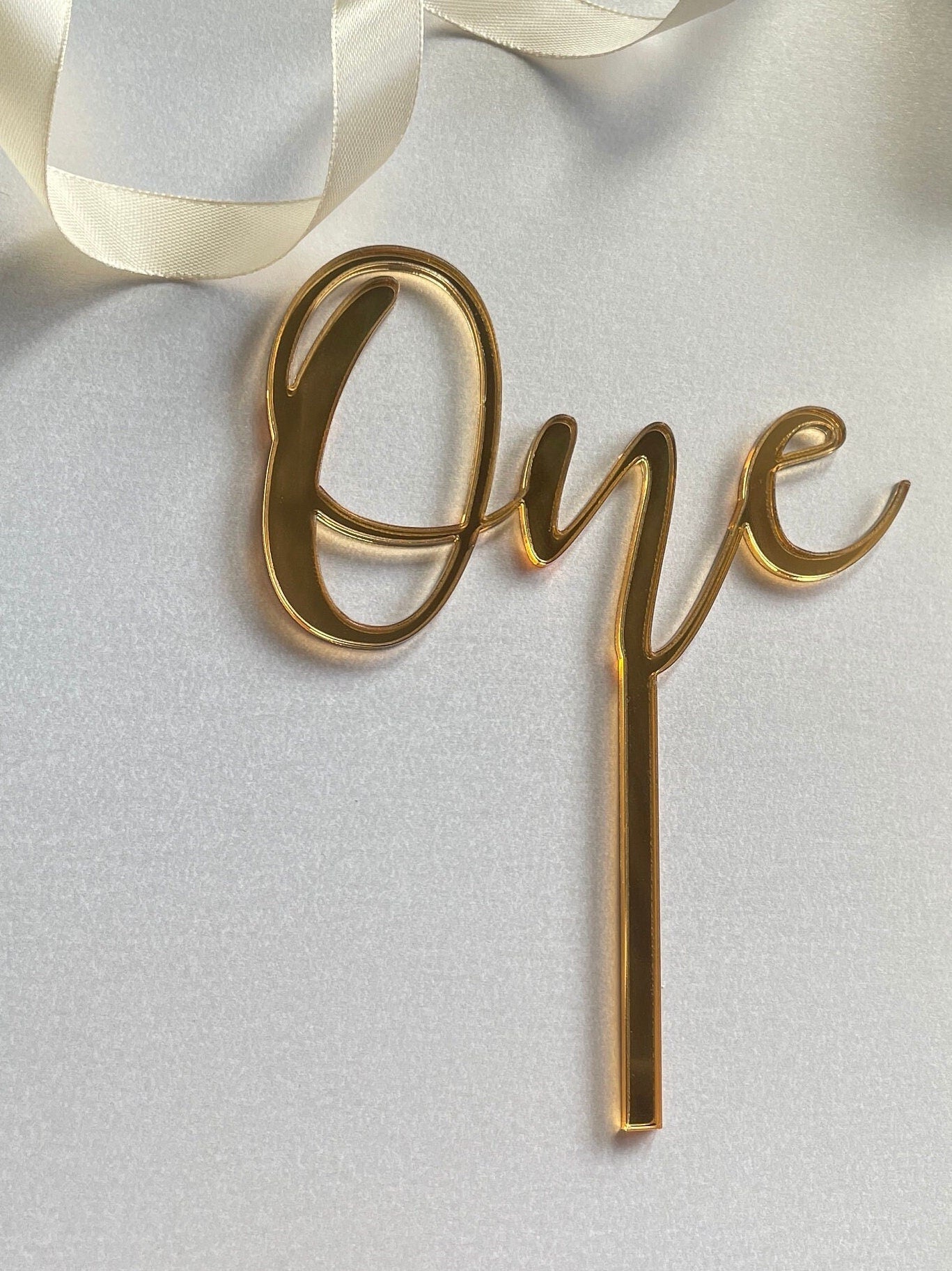 One cake topper. Mirrored acrylic topper. One  cake charm