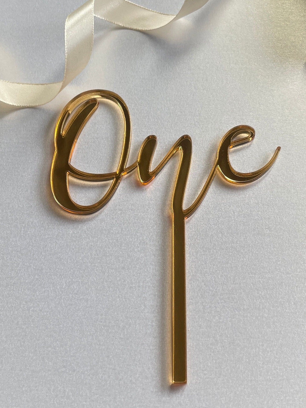 One cake topper. Mirrored acrylic topper. One  cake charm