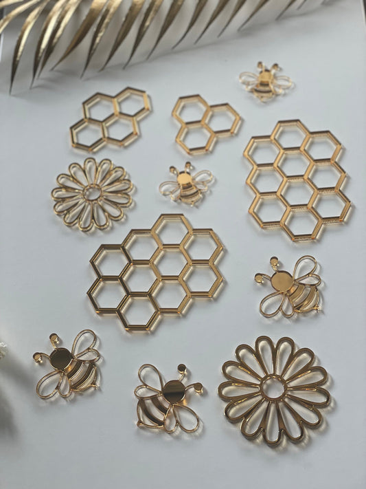 Bee gold acrylic charms . Honey comb charms.