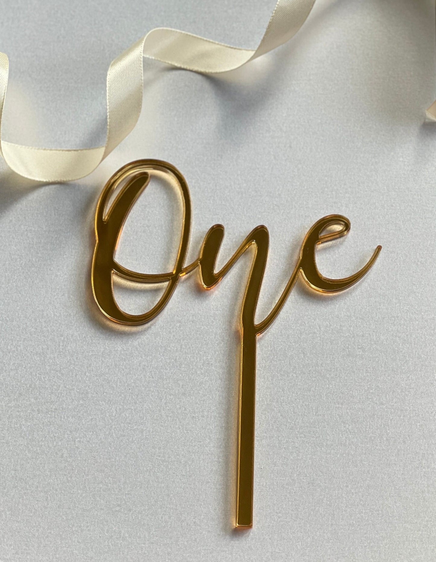 One cake topper. Mirrored acrylic topper. One  cake charm